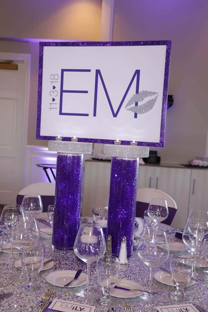 Custom Logo Centerpiece with Glittered Border and LED Aqua Gems Cylinders for Purple Themed Bat Mitzvah