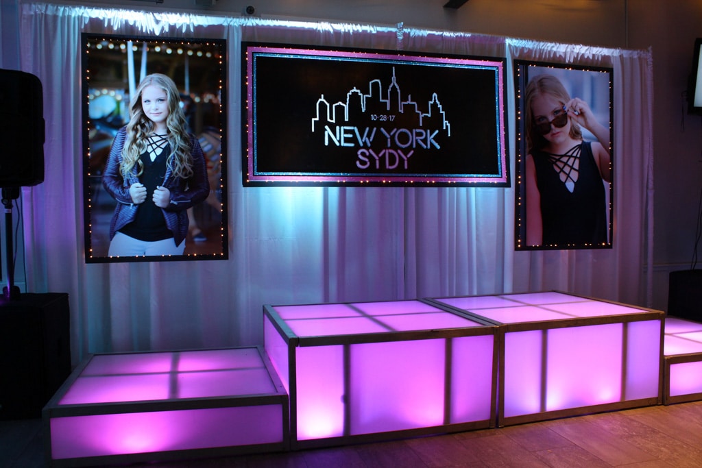 NYC Themed Backdrop with Custom Logo and Blowup Photos
