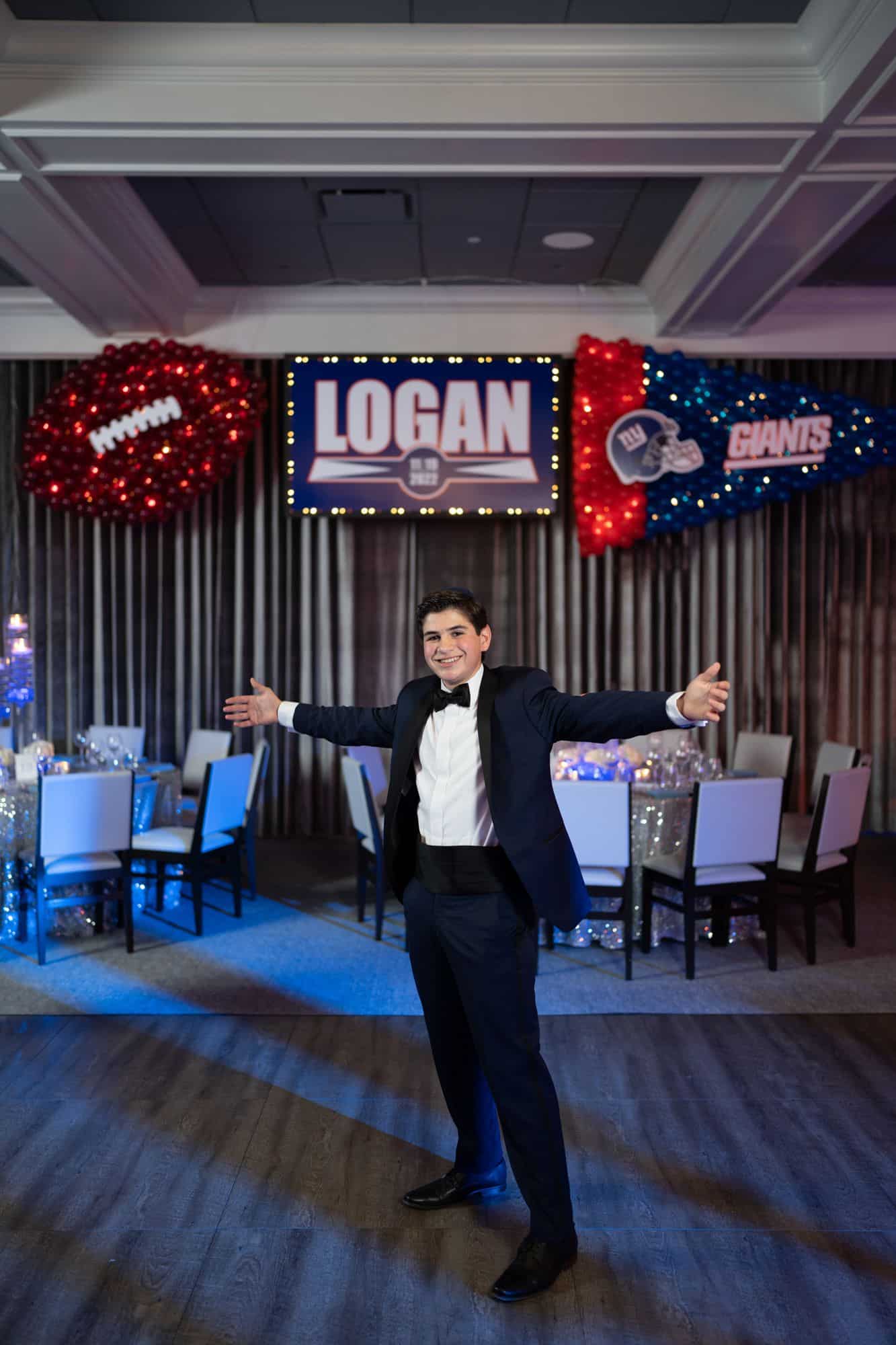 Giants Themed Backdrop with Football and Pennant Balloon Sculpture for Football Themed Bar Mitzvah at Alpine Country Club