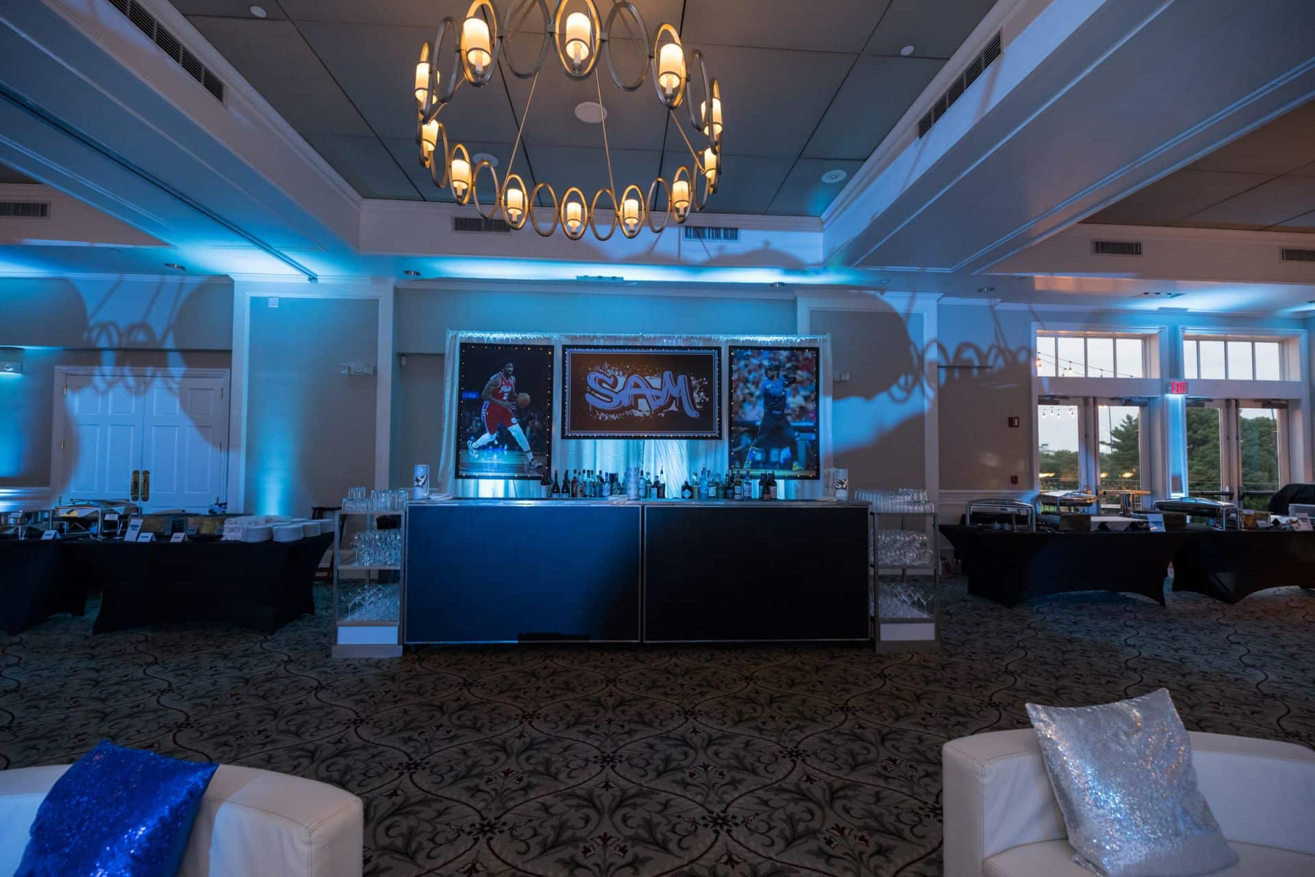 Custom Backdrop with Blow Up Photos for a Sports Themed Bar Mitzvah at Harrison Meadows Country Club