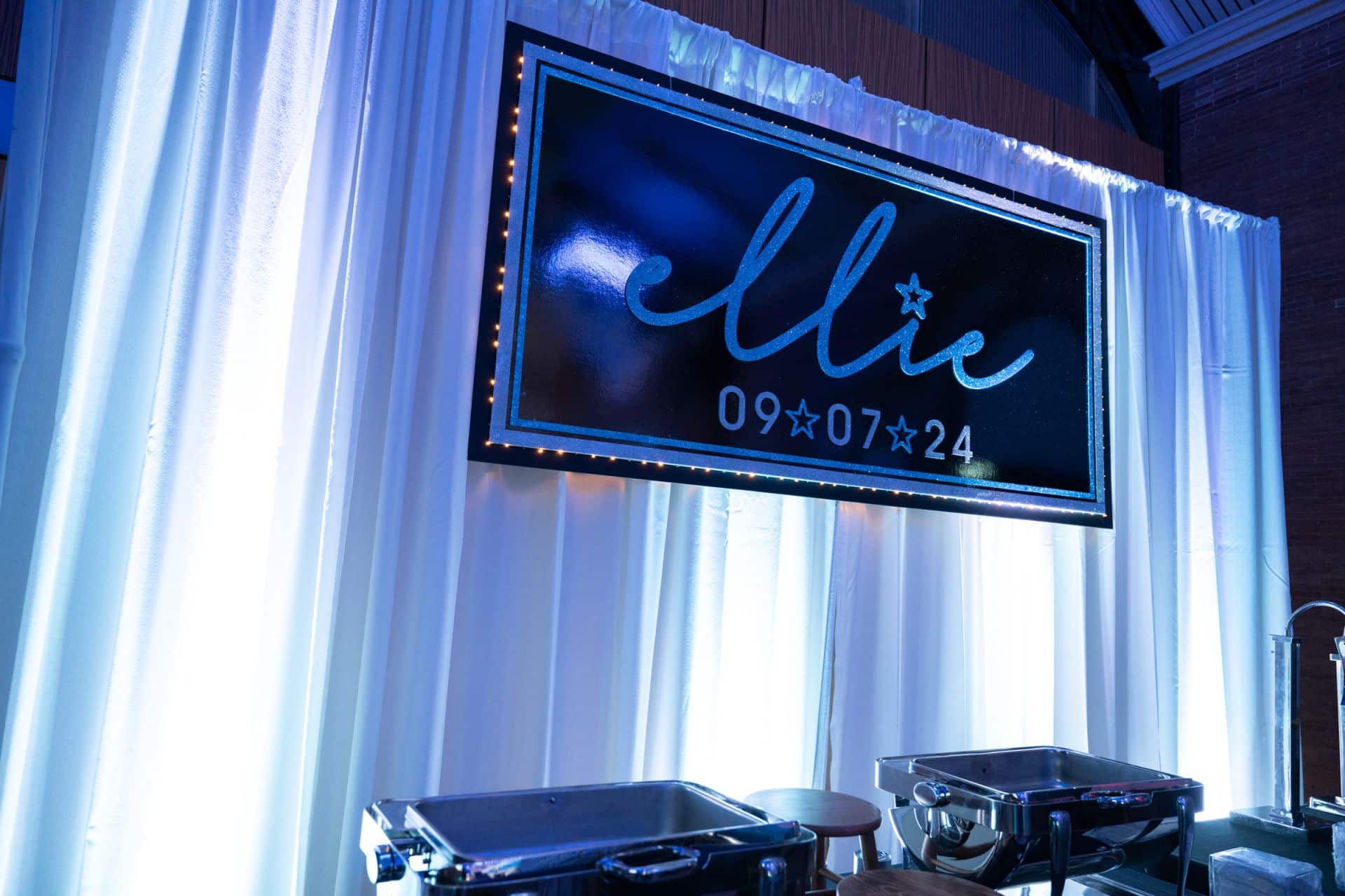 Custom Backdrop with LED Uplighting on Pipe and Drape