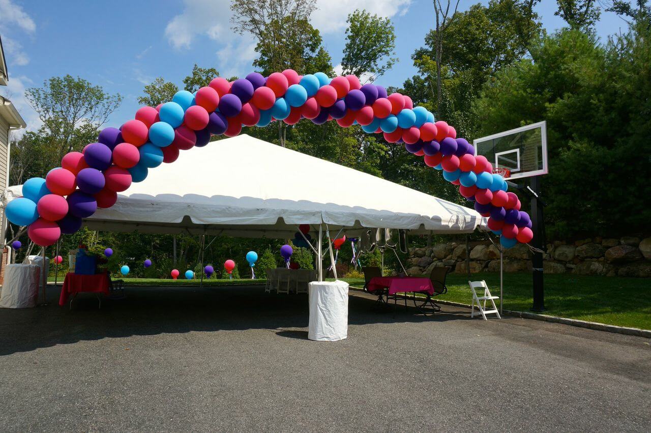 Outdoor First Birthday with Cluster Balloon Arch over Tent