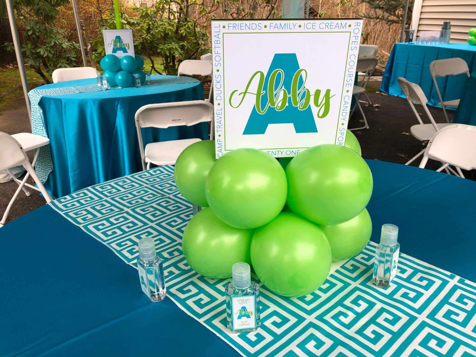 Turquoise and Lime Balloon Centerpieces with Custom Logo Sign for Outdoor Tent Event