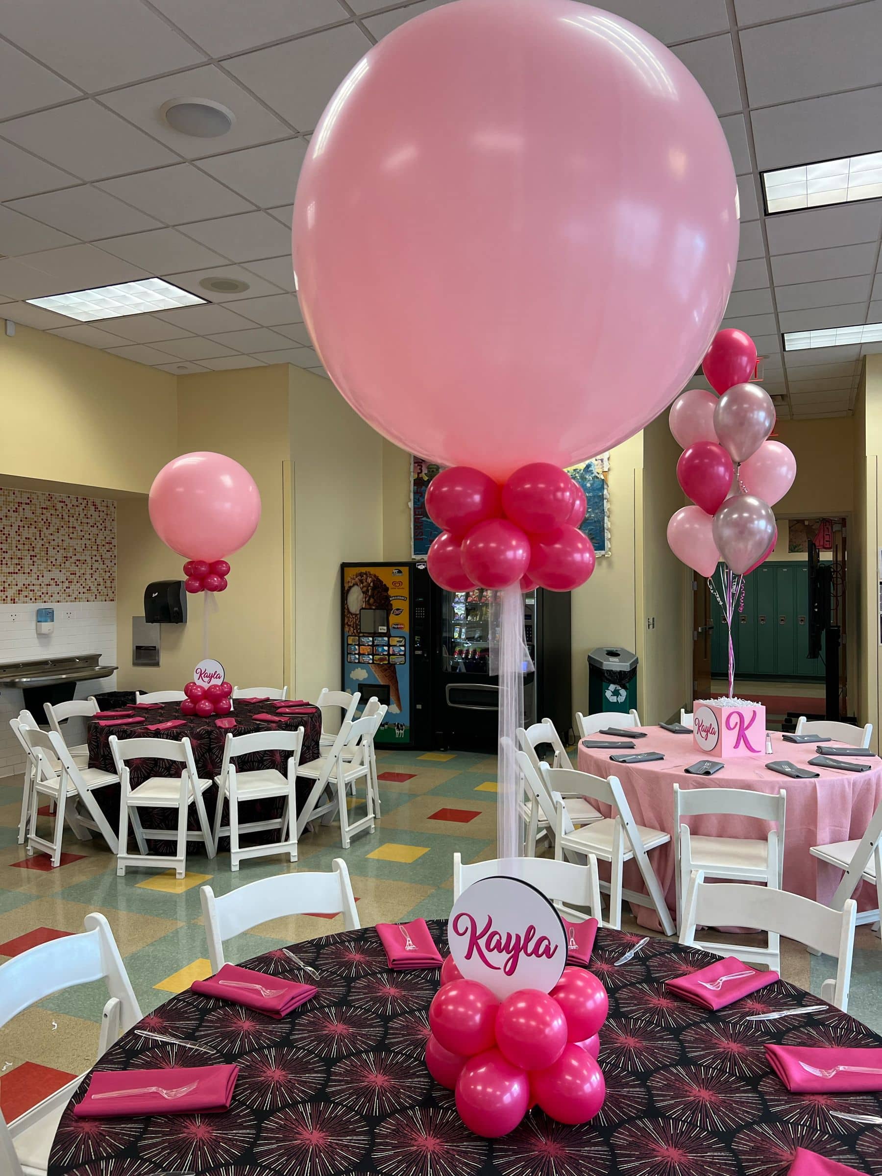 Hot Pink and Light Pink Balloon Centerpiece with Custom Logo Cutout in Base