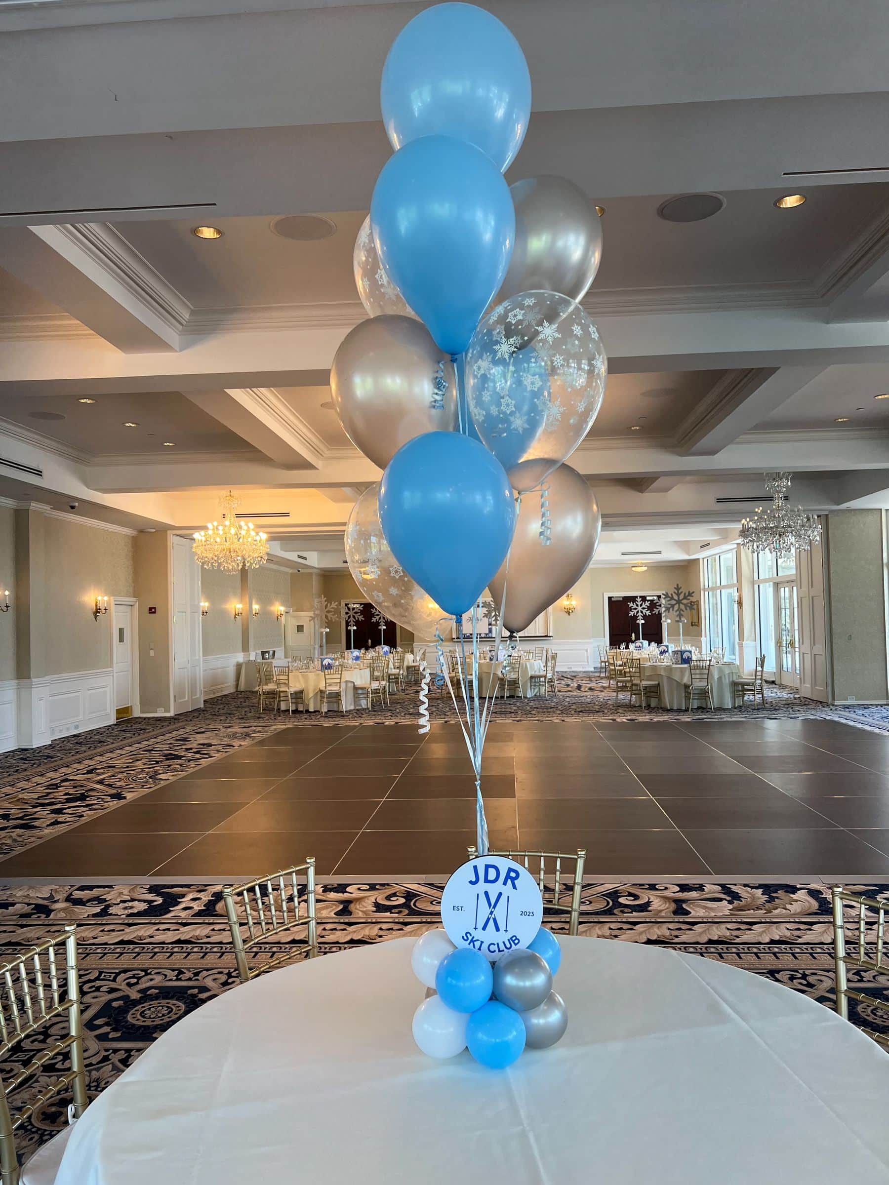 Ski Themed Balloon Centerpiece with Snowflake Balloons and Custom Logo