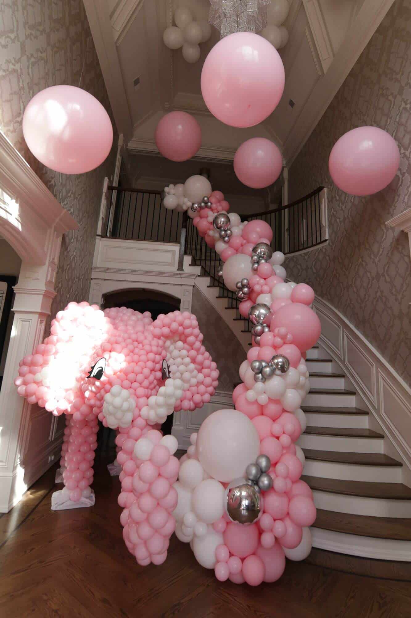 Elephant Balloon Sculpture with Organic Balloon Garland Over Stairway and Ceiling Treatment