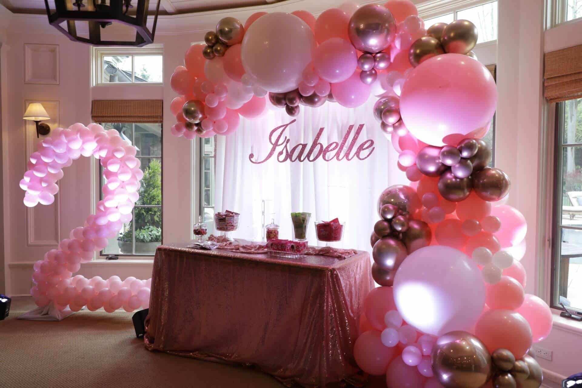 Number 1 Balloon Sculpture with Signage and Organic Balloon Arch over Candy Bar Table