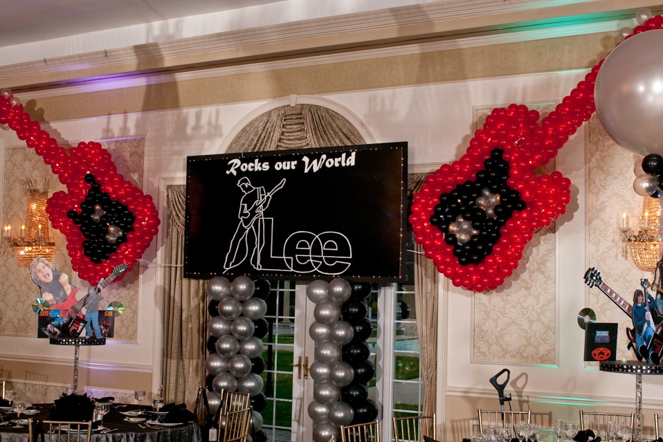 Balloon Sculpture Guitars with Custom Themed Backdrop