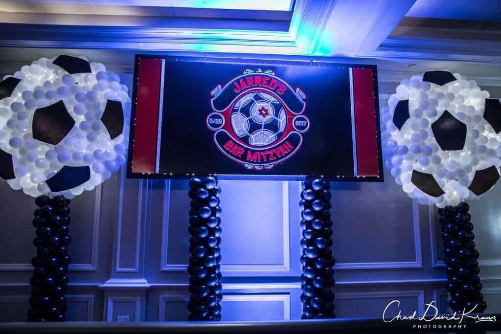 Soccer Ball Balloon Sculpture near Custom Backdrop for Soccer Themed Bar Mitzvah