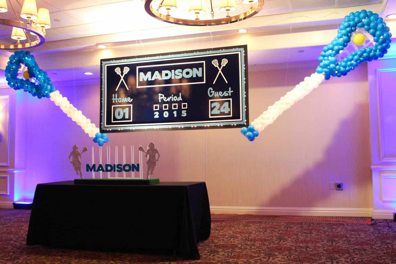 Lacrosse Sticks Balloon Sculptures with Custom Score Board Backdrop