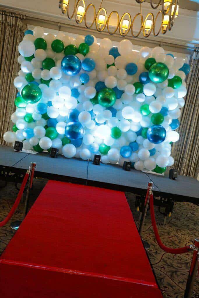 Organic Balloon Wall Backdrop with LED Uplighting and Red Carpet Display for Charity Event