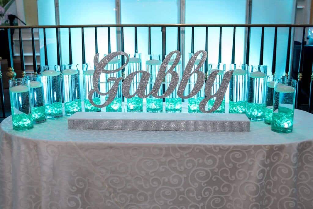 LED Candle Lighting Display with Custom Glittered Name and Cylinders with Floating Candles