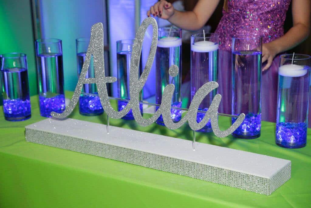 LED Candle Lighting Display with Custom Glittered Name and Cylinders with Floating Candles