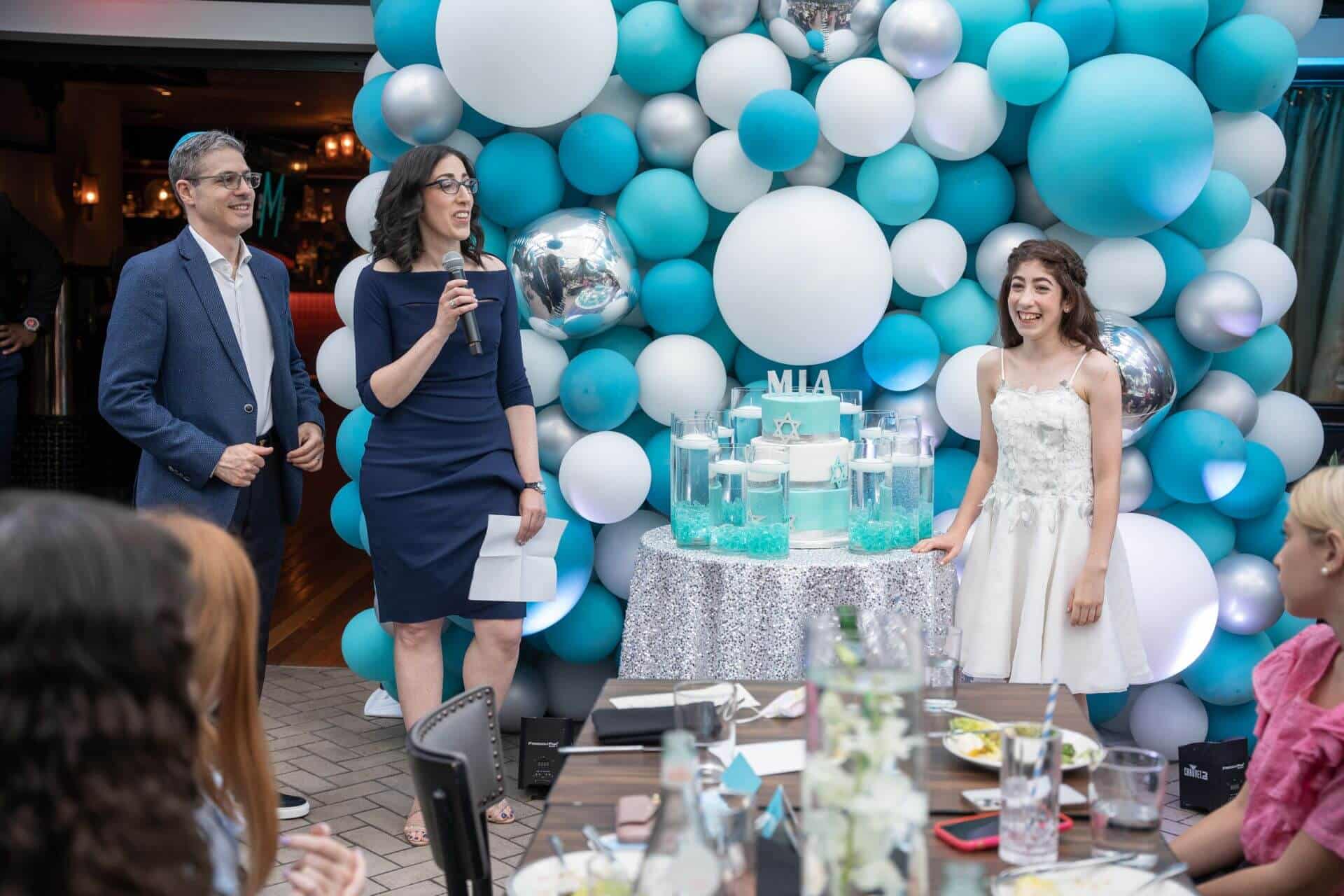 LED Candle Lighting Display with Cylinders and Floating Candles Around Cake and Organic Balloon Wall