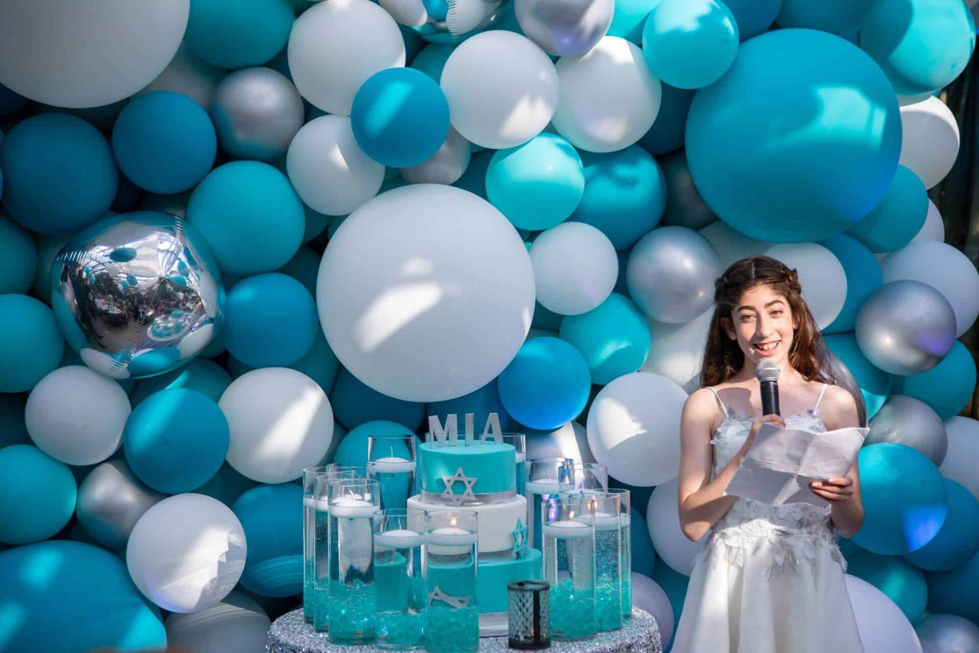 LED Candle Lighting Display with Cylinders and Floating Candles Around Cake and Organic Balloon Wall