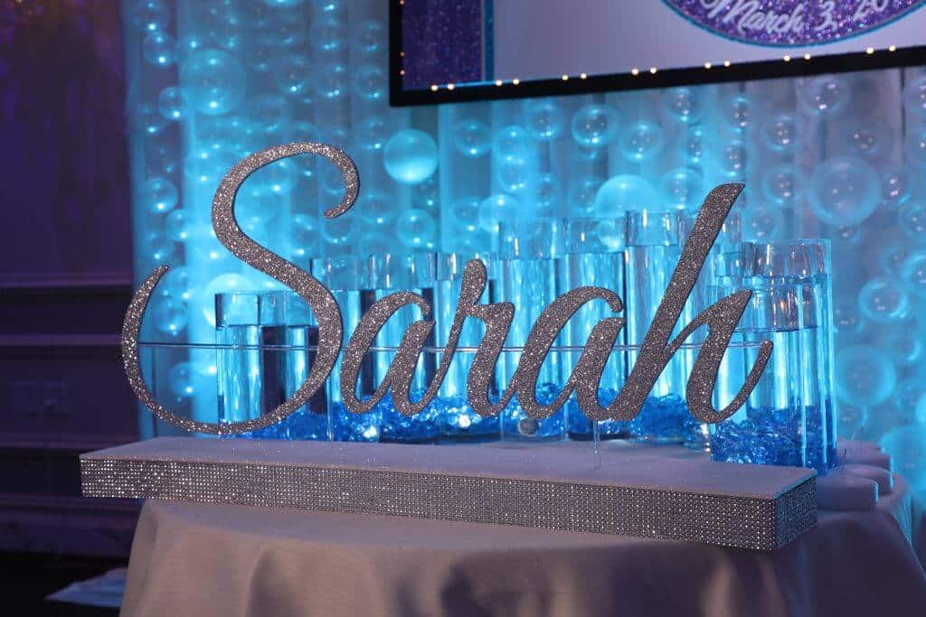 LED Candle Lighting Display with Custom Glittered Name and Cylinders with Floating Candles