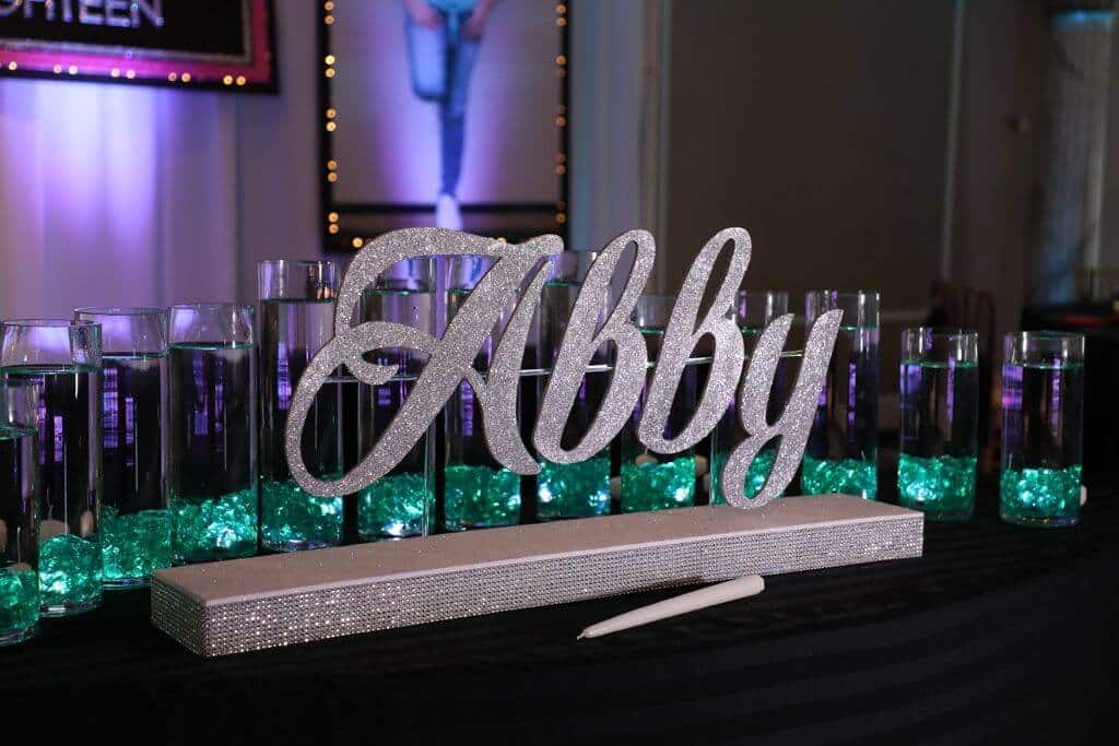 LED Candle Lighting Display with Custom Glittered Name and Cylinders with Floating Candles