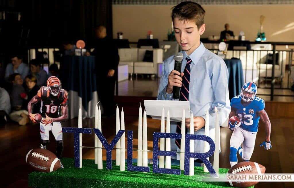 Football Themed Candle Lighting Display with Player Cutouts and Footballs