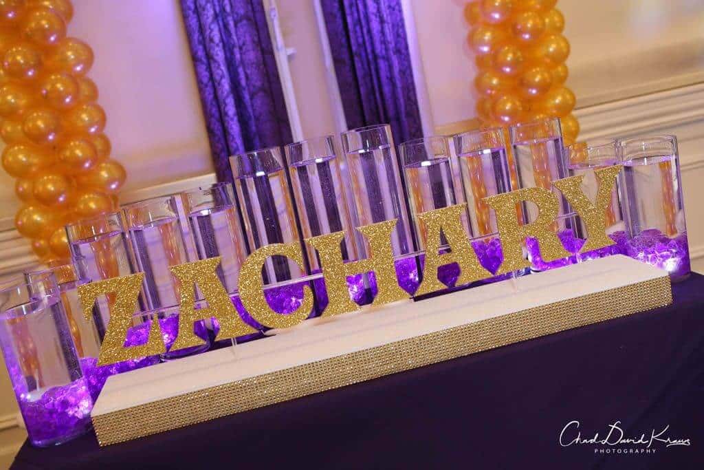 LED Candle Lighting Display with Custom Glittered Name and Cylinders with Floating Candles
