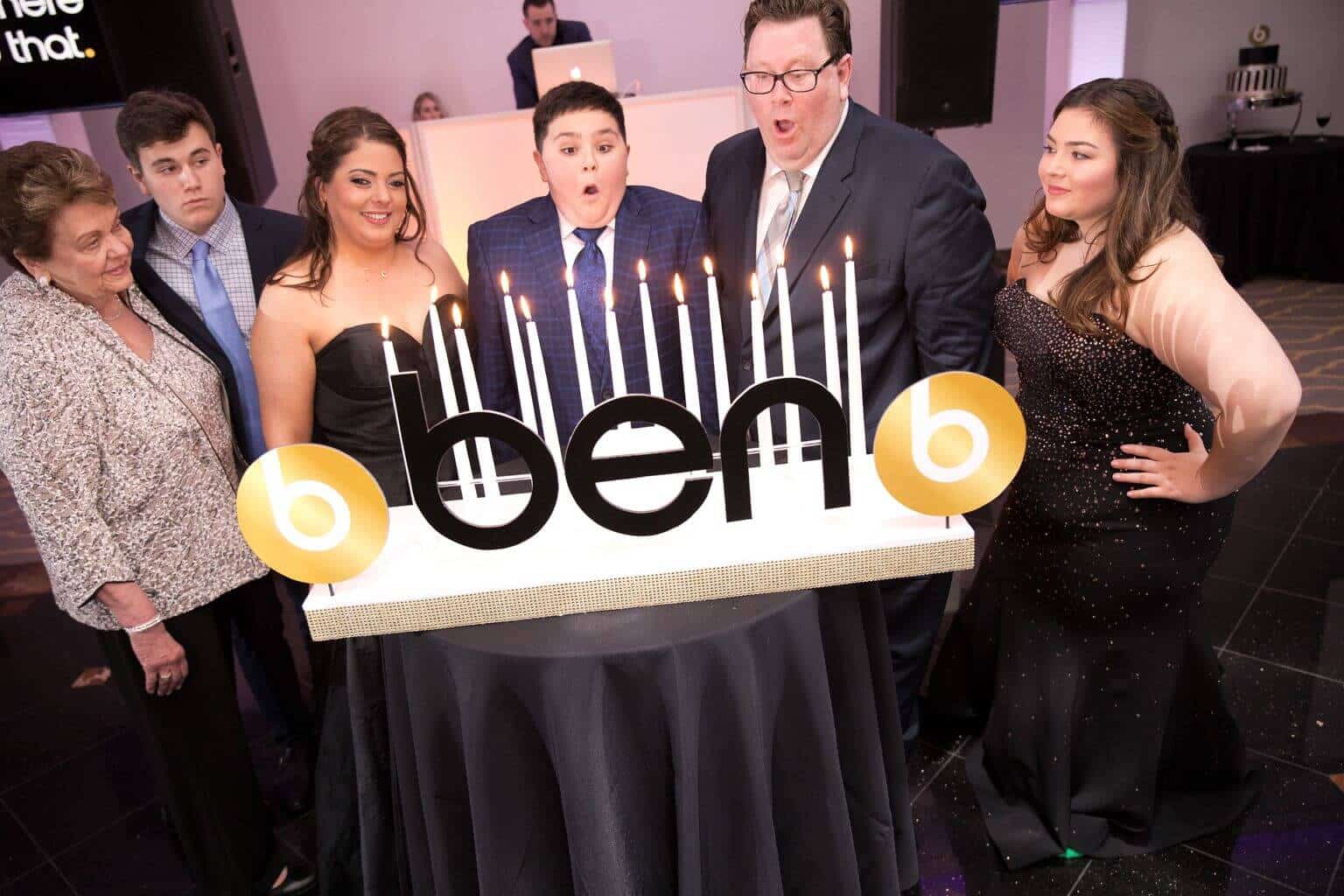 Black and Gold Candle Lighting Display with Custom Logo