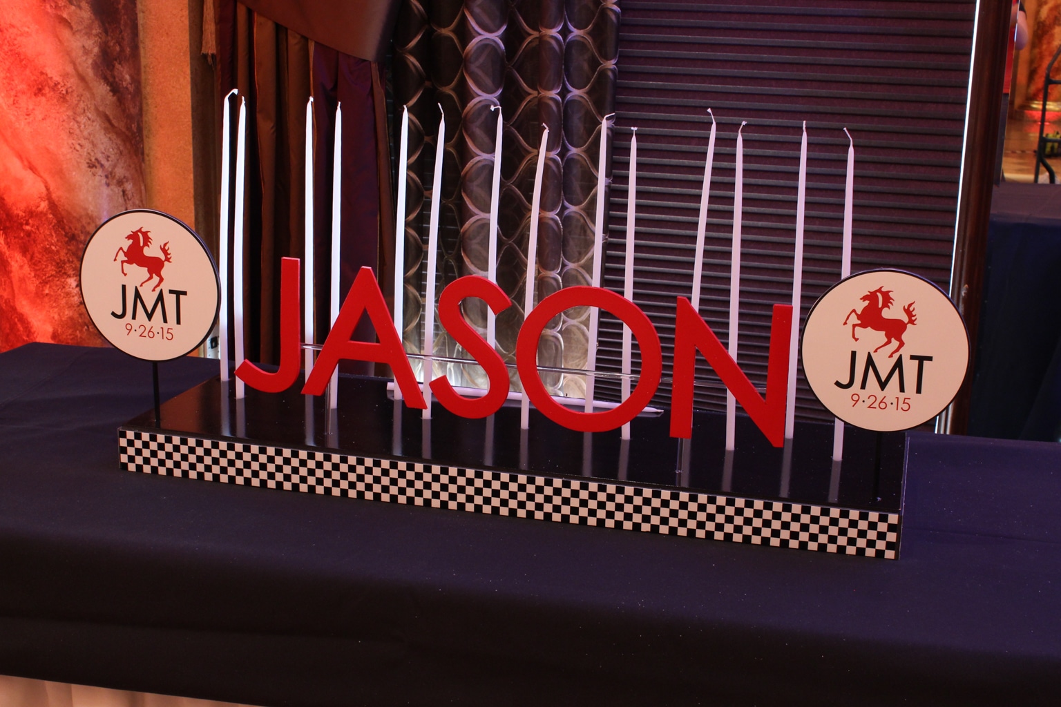 Car Themed Candle Lighting Display with Custom Logo and Checkered Flag Ribbon