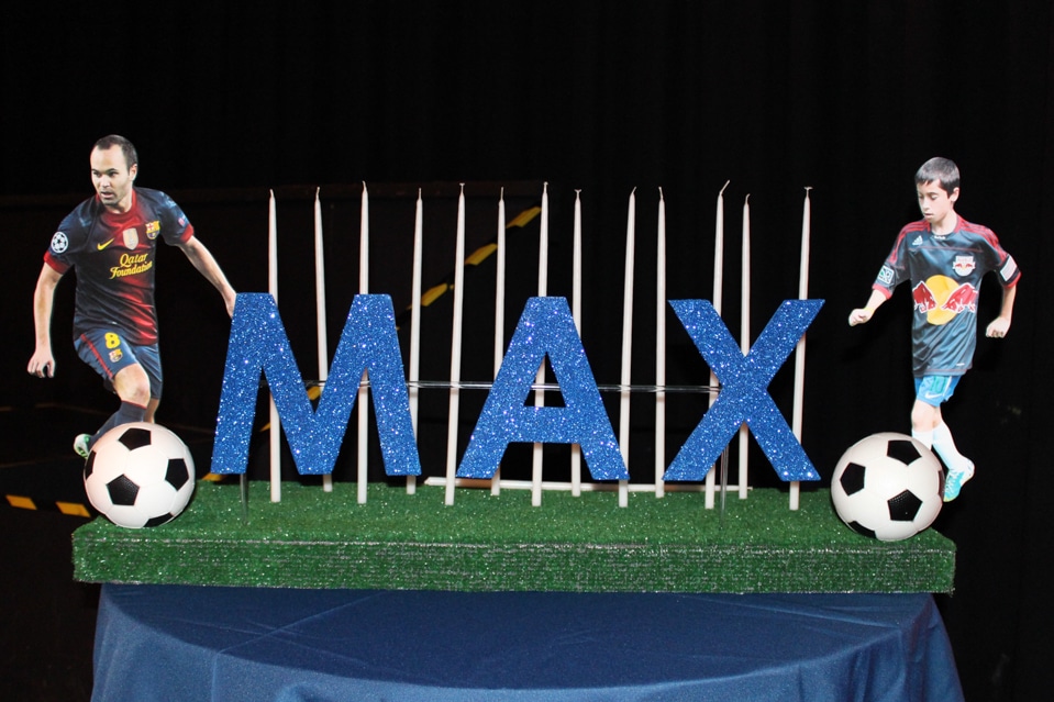 Soccer Themed Candle Lighting Display with Cutout Photos and Soccer Balls