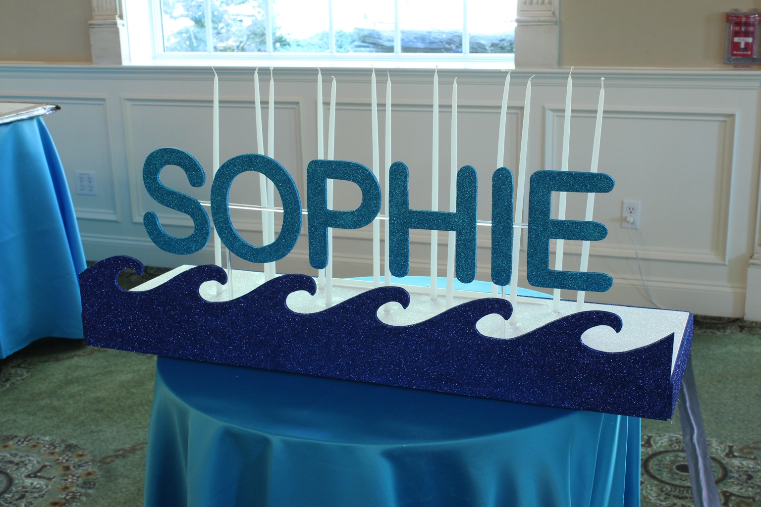 Swim Themed Candle Lighting Display with 3D Wave Cutout and Glittered Name