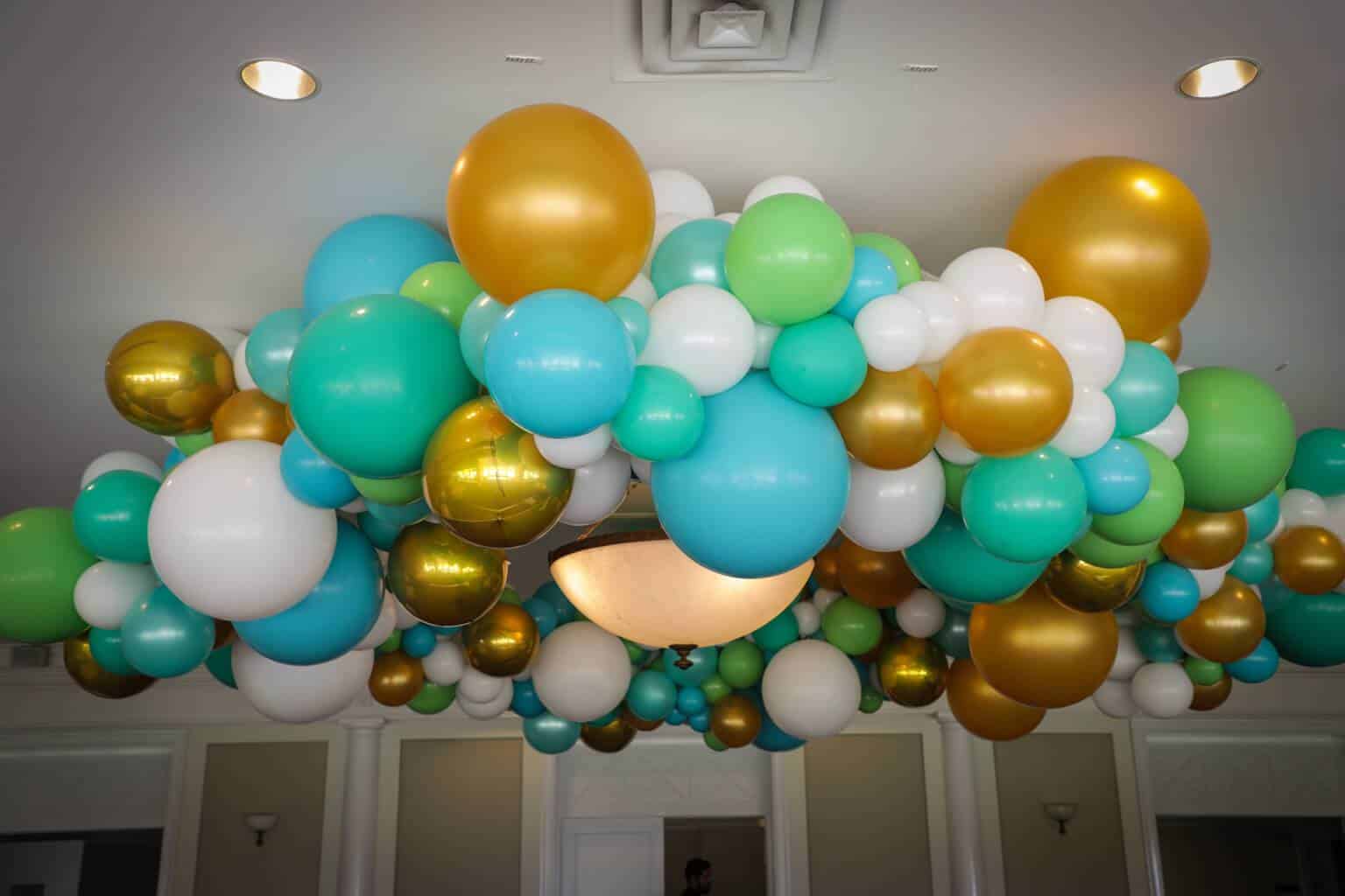 Turquoise and Gold Organic Ceiling Balloon Sculpture at Hampshire Country Club