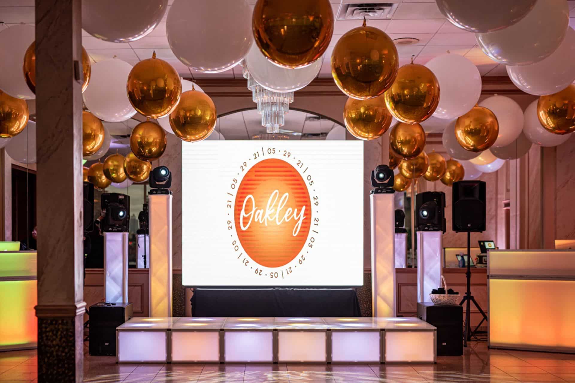 Large White Balloons and Gold Orbz Ceiling Treatment Over Dance Floor for Indoor Bat Mitzvah