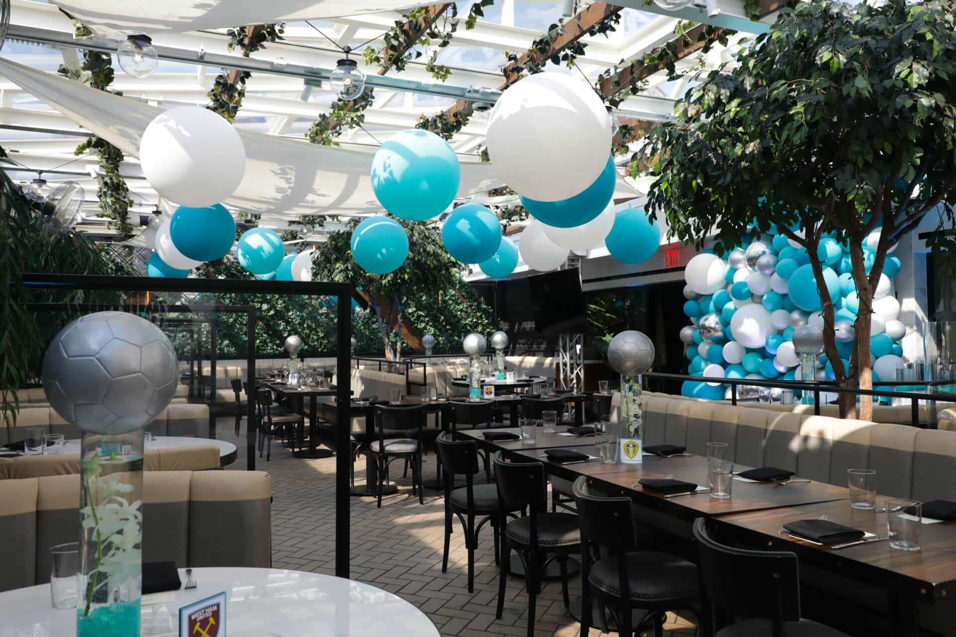 While and Turquoise Large Balloons on Tent Ceiling For Outdoor Bat Mitzvah Decor