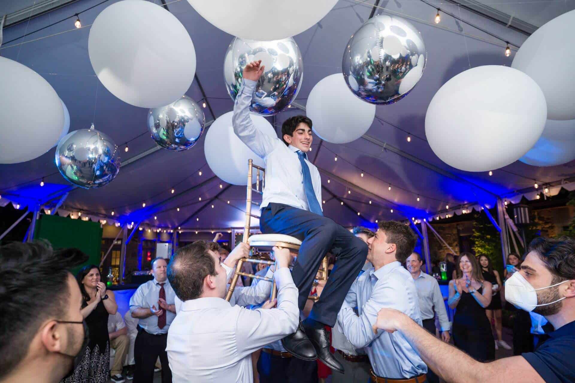 Large White Balloons and Silver Metallic Orbz over Dance Floor for Outdoor Bar Mitzvah
