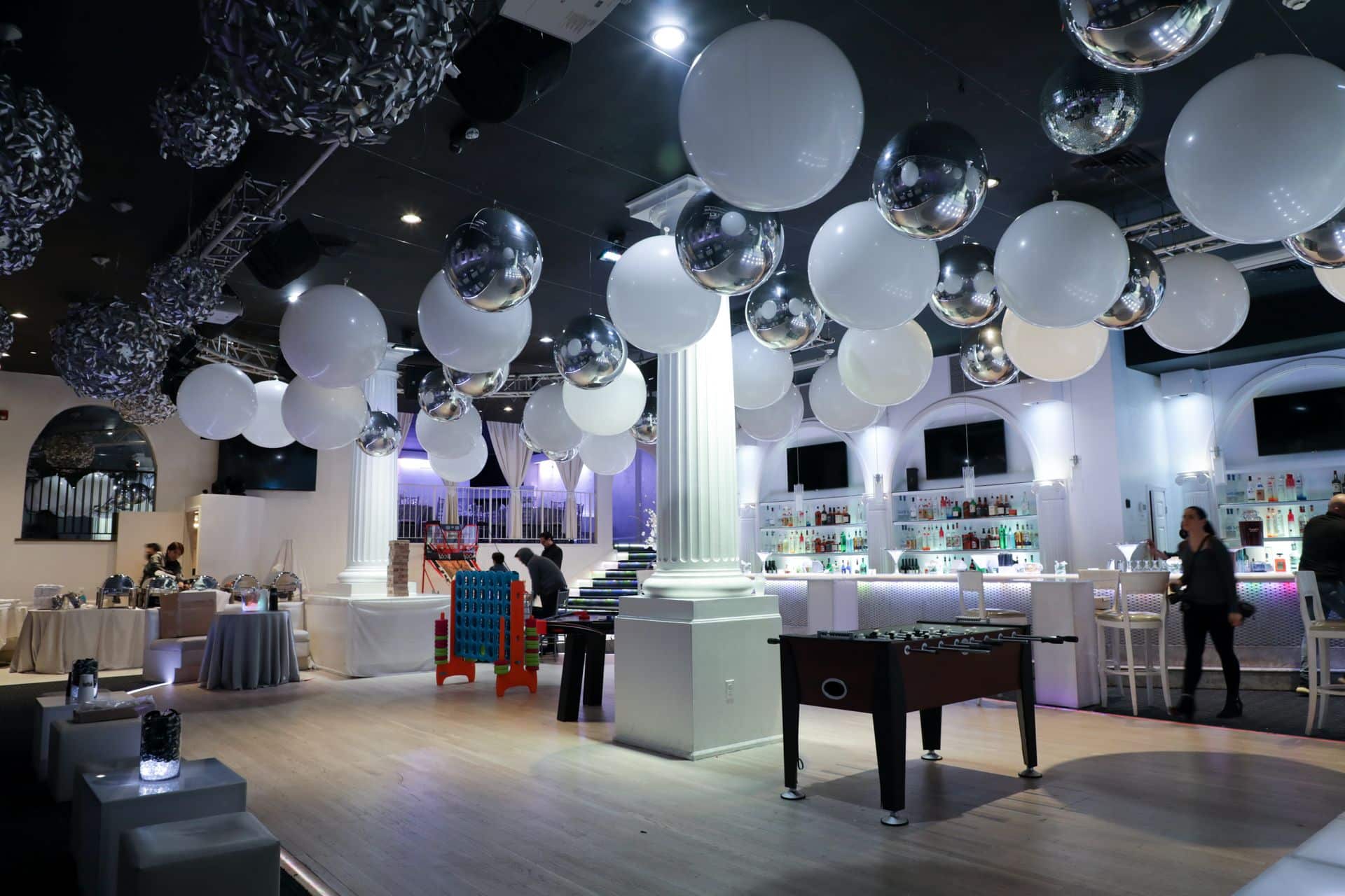White and Silver Ceiling Balloons over Dance Floor at Coliseum White Plains