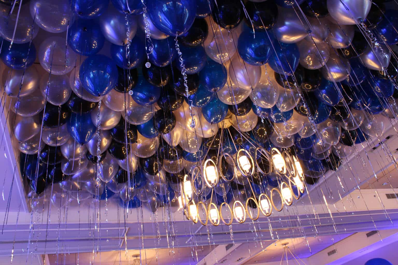 Blue, Black and Silver Ceiling Balloons with Shimmer Ribbon and LED Sparkle Ribbon at Willow Ridge Golf Club