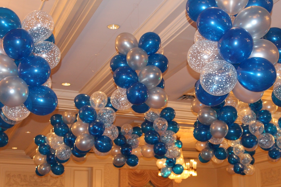 Blue and Silver Balloon Clusters Hanging from the Ceiling