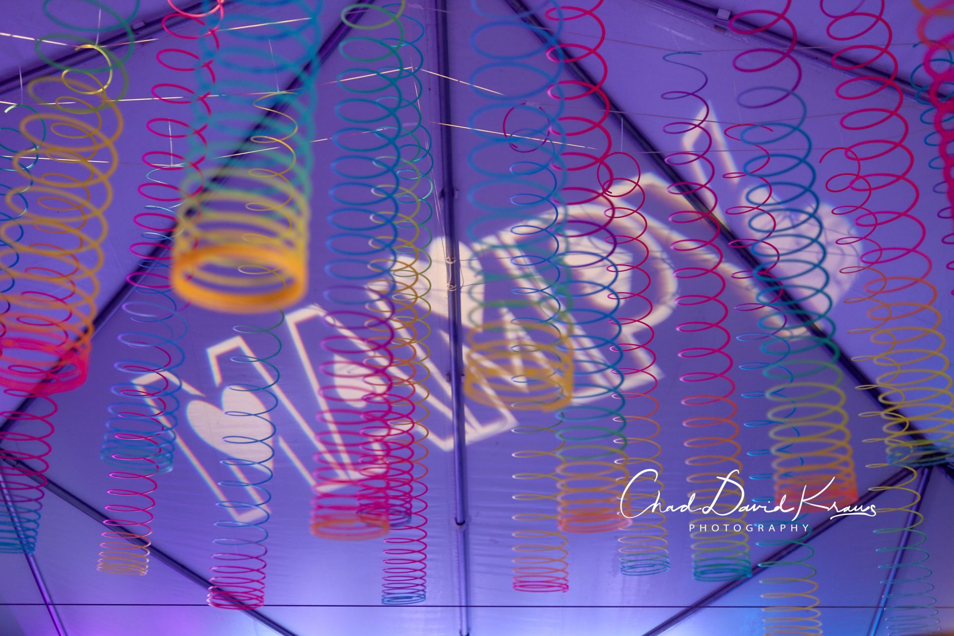 Fun Slinky Ceiling Treatment Over Dance Floor for Tent Party Decor