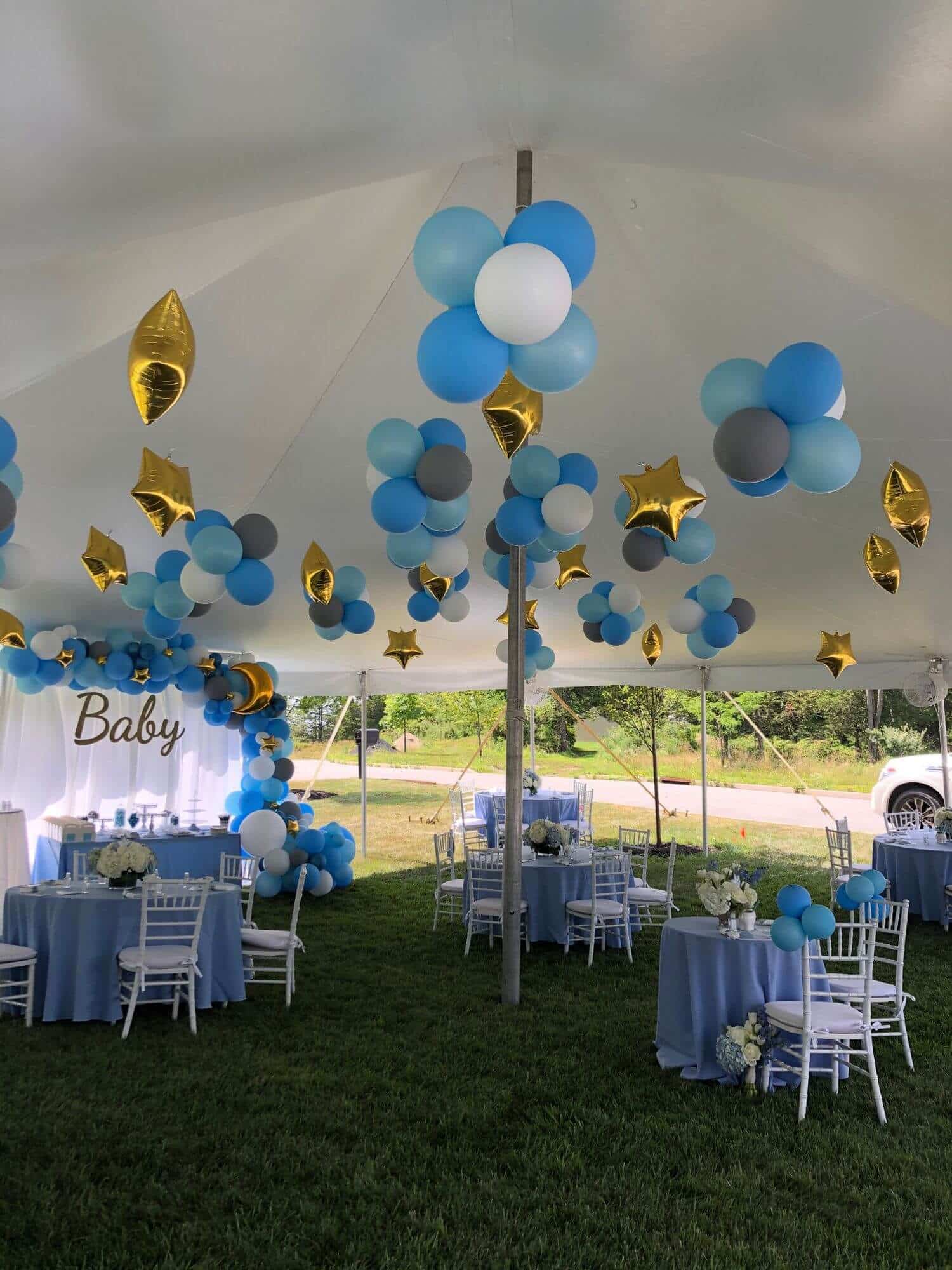Clusters of Balloons and Dazzle Stars on Tent Ceiling For Outdoor Baby Shower