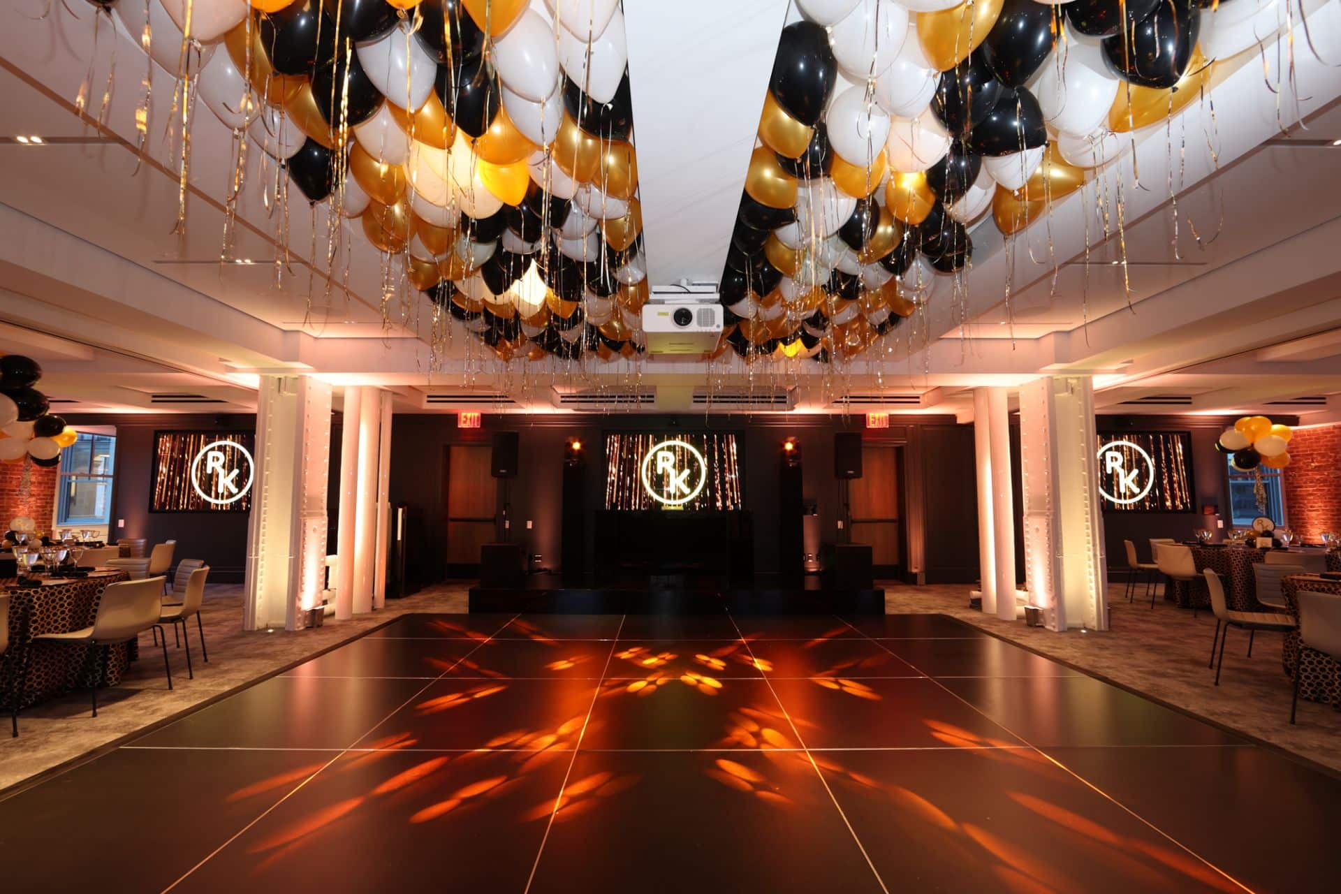 Gold, Black and White Ceiling Balloons with Shimmer Ribbon over Dance Floor for Graduation at Studio Gather, NYC