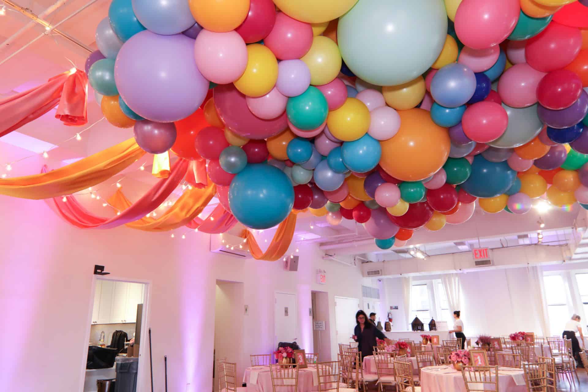 Multi Colored Organic Balloon Install with Fabric Draping for Carnival Themed Bat Mitzvah at Midtown Loft, NYC