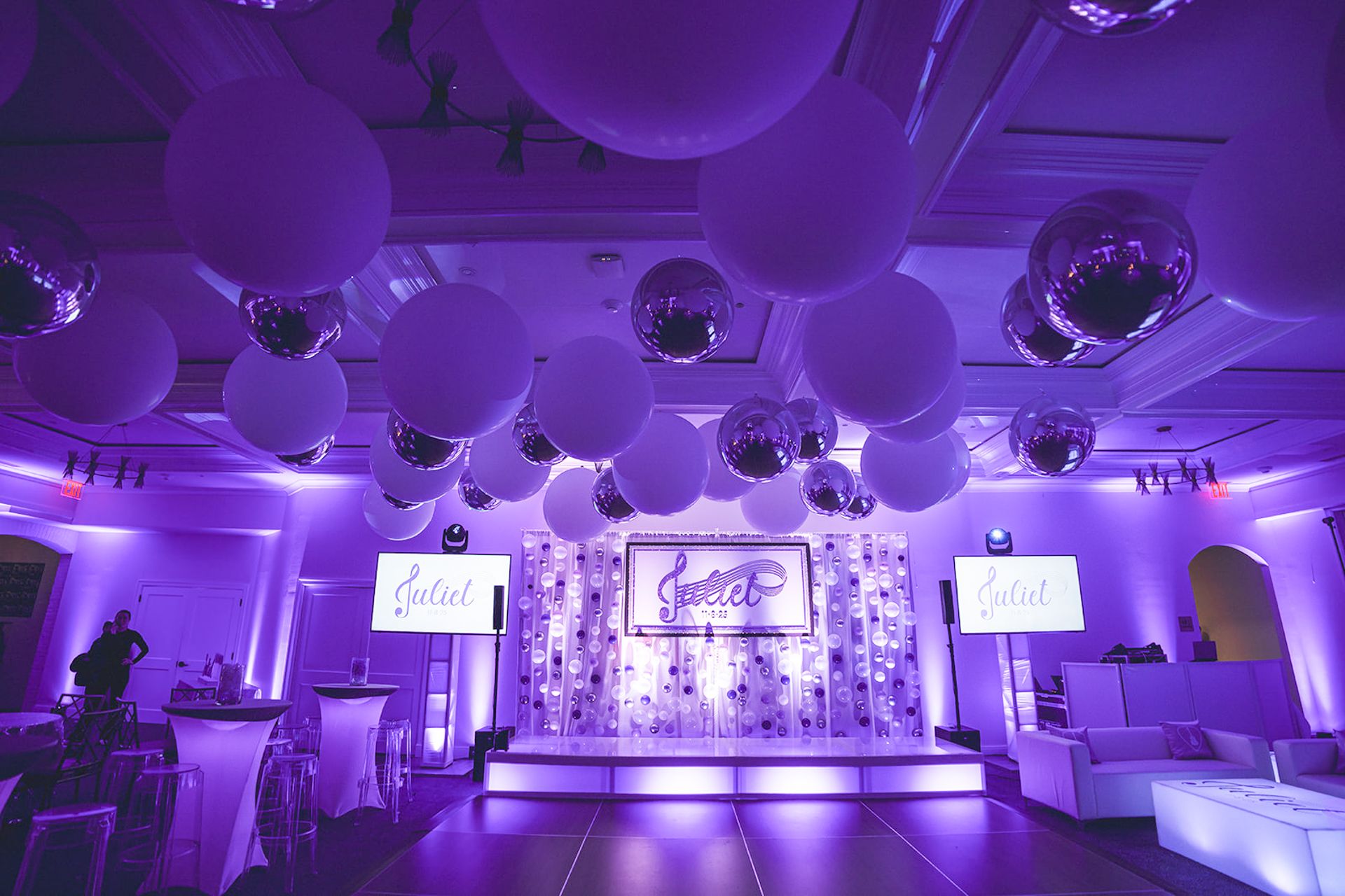 White & Silver Balloon Ceiling in a Lavender-Uplighted Room for a Bat Mitzvah at Coveleigh Club