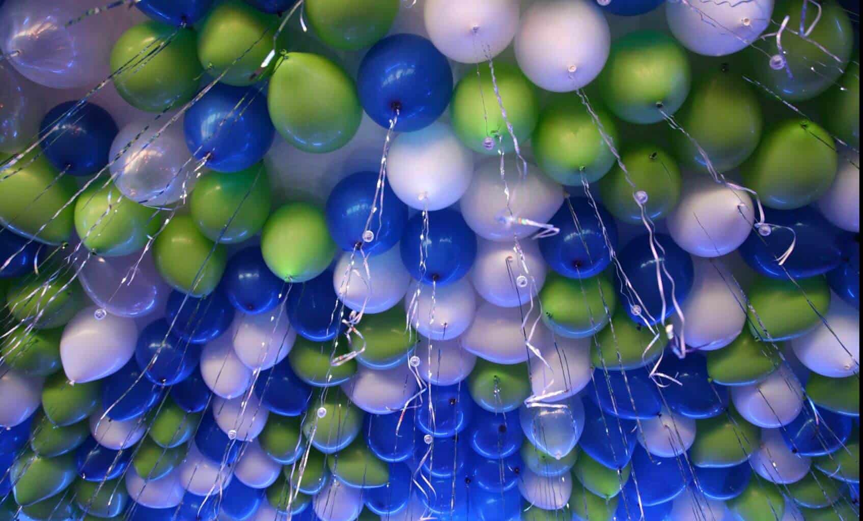 Lime and Royal Loose Ceiling Balloons with Ribbons over Dance Floor
