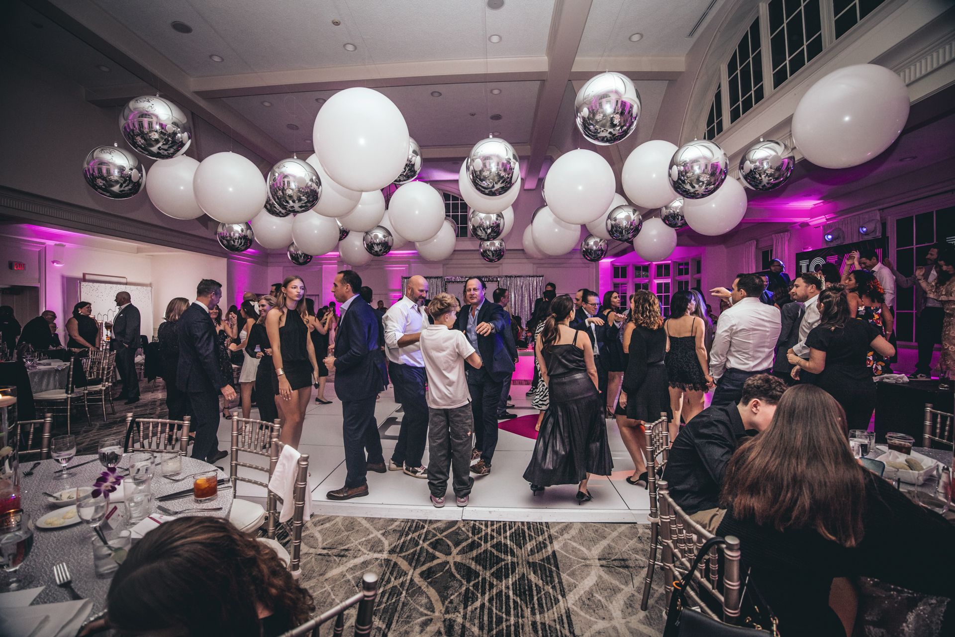 Silver Metallic Orbs & White Latex Balloon Ceiling Install for a Bat Mitzvah at Orange Lawn Tennis Club