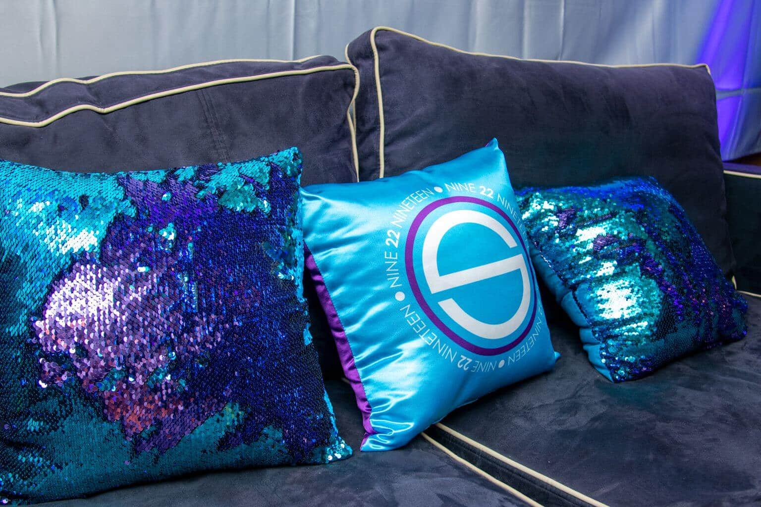 Turquoise and Purple Pillow with Custom Logo