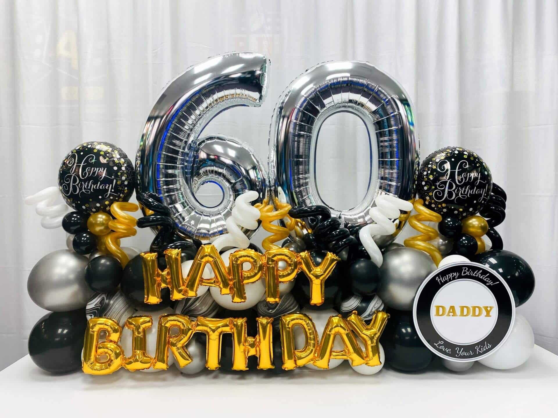 60th Birthday Balloon Bouquet with Custom Sign in Black, White, Gold and Silver
