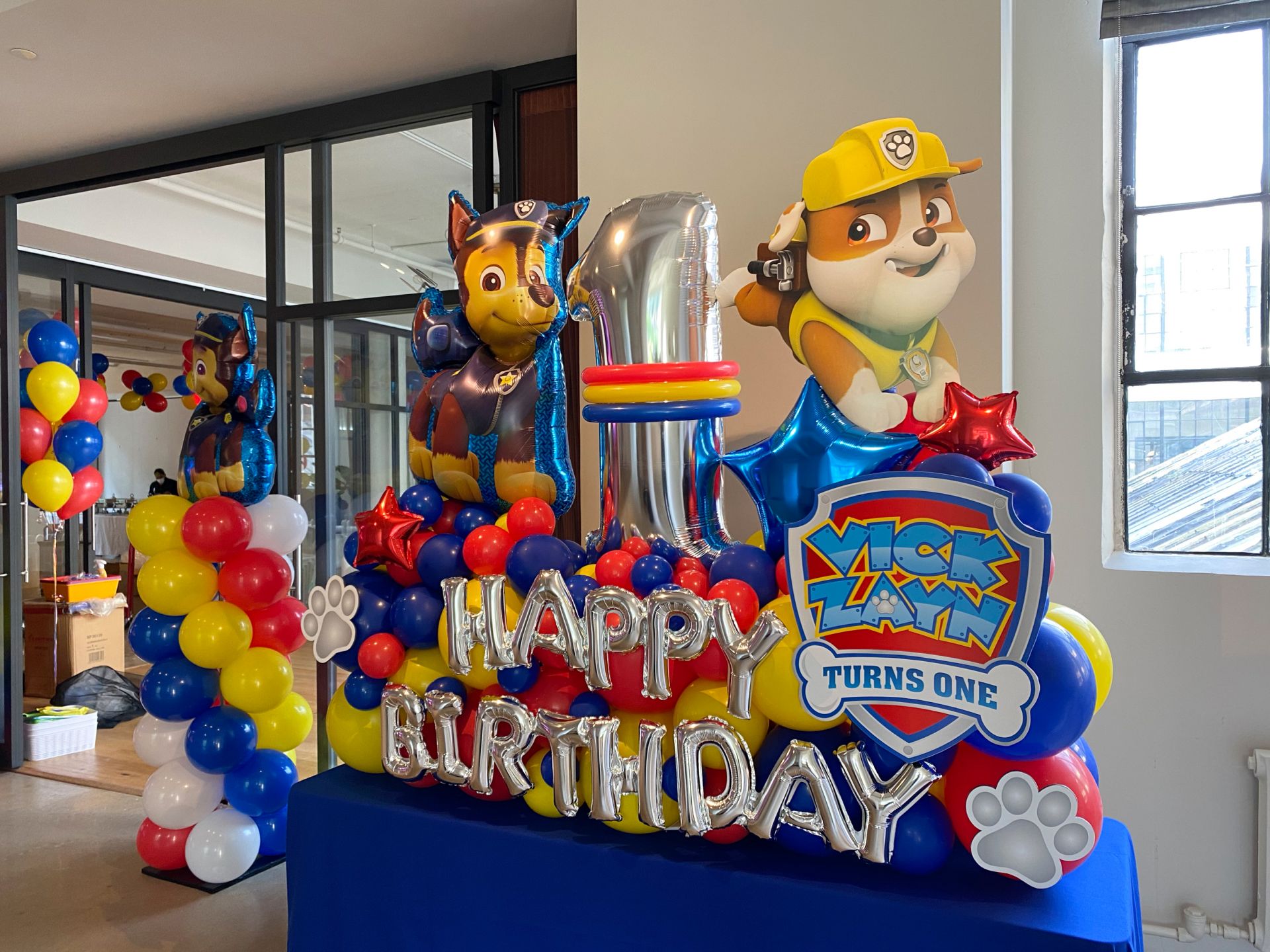 Paw Patrol Themed Fancy Balloon Bouquet with Custom Sign and Paw Prints, Custom Paw Patrol Balloon Column and Balloon Tree for First Birthday Party