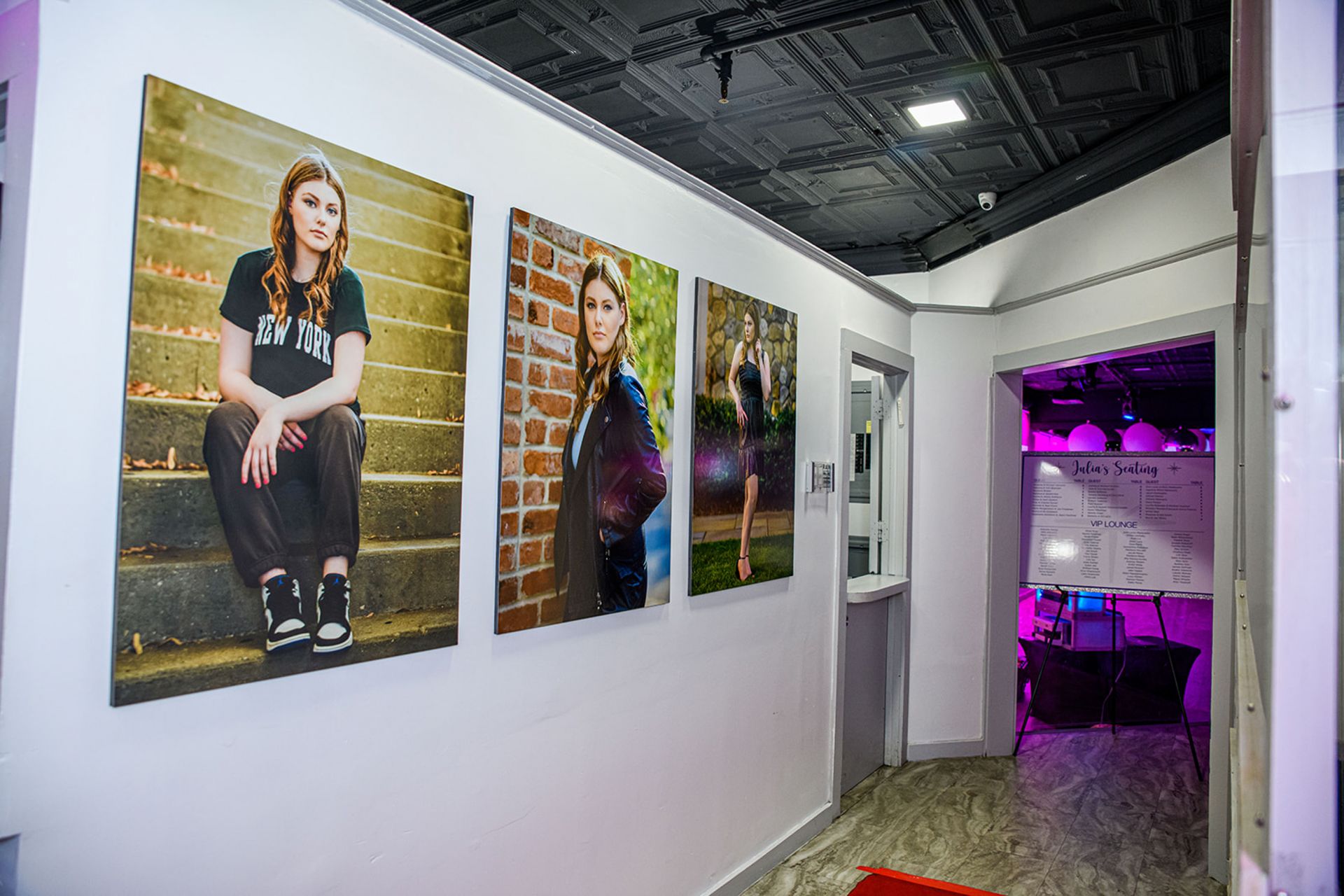 Beautiful Blow Up Pictures Around Hallway and Seating Chart Display for Bat Mitzvah Entrance Decor