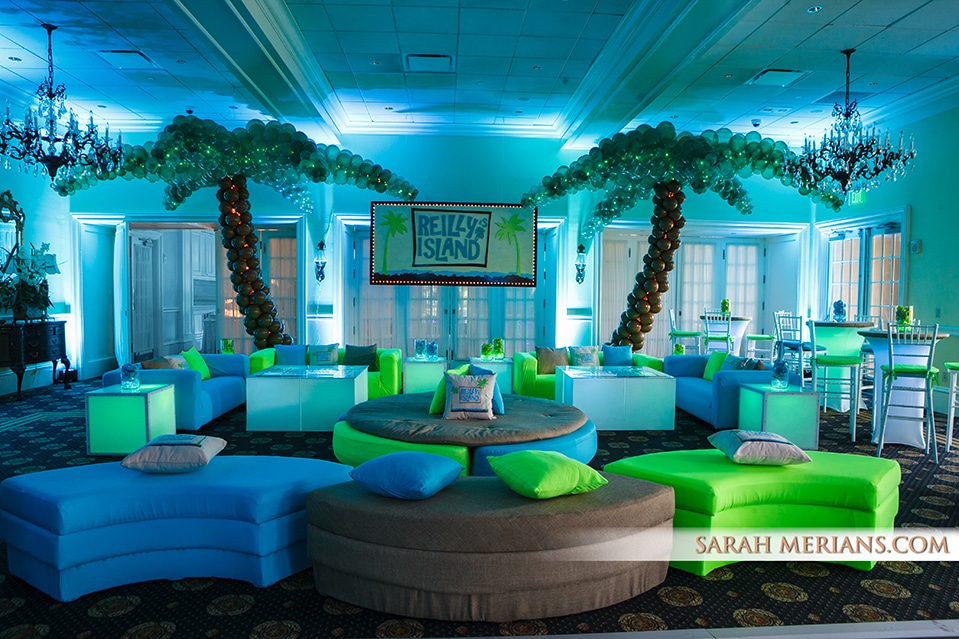 Tropical Island Themed Lounge with Custom Backdrop and Palm Tree Balloon Sculptures
