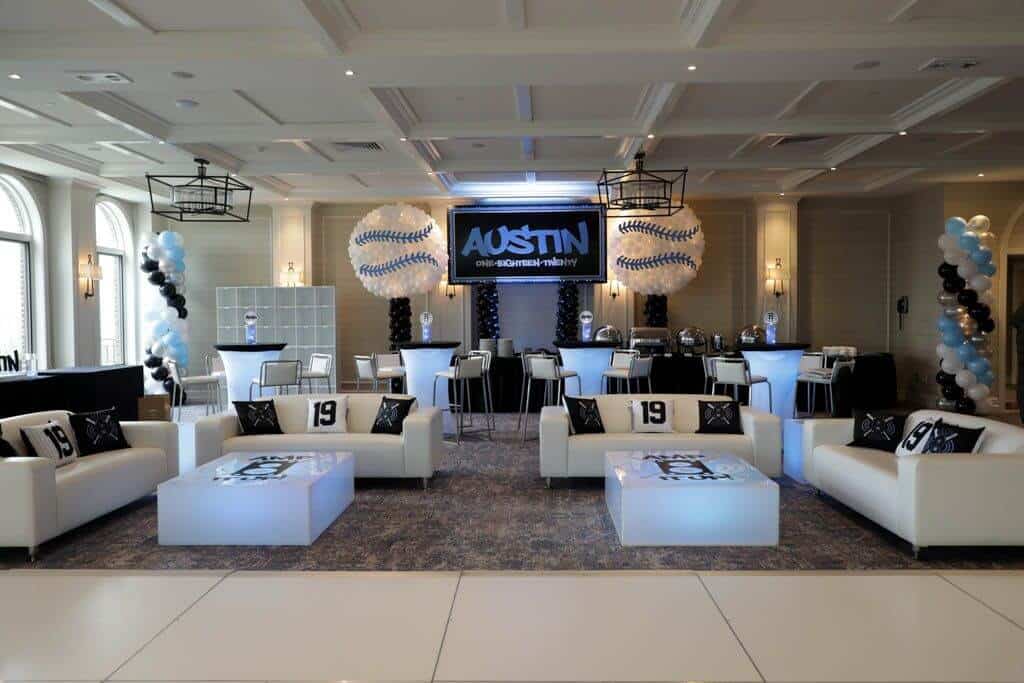 Baseball Themed Lounge Setup with Custom Logo Tables and Pillows at Ardsley Country Club