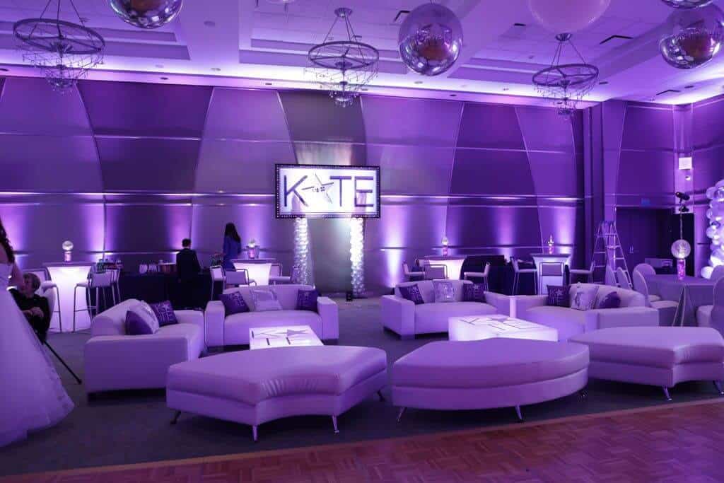 Bat Mitzvah Lounge Setup with Custom Logo Tables, Pillows and Glittered Name Backdrop at Kol Ami, White Plains