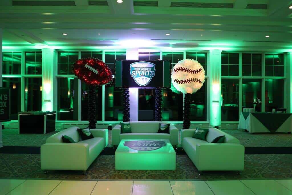Sports Themed Lounge Setup with LED Furniture and Pillows at Beach Point Club, NY