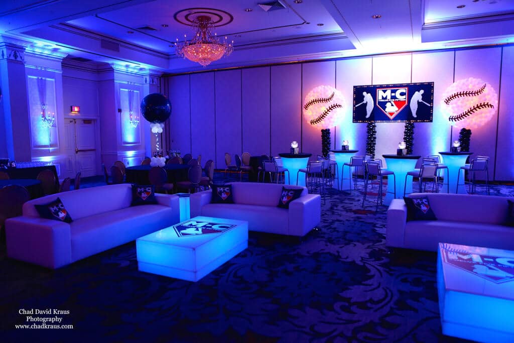 Baseball Themed Lounge with Logo Backdrop, Baseball Balloon Sculptures and Blue Lighting